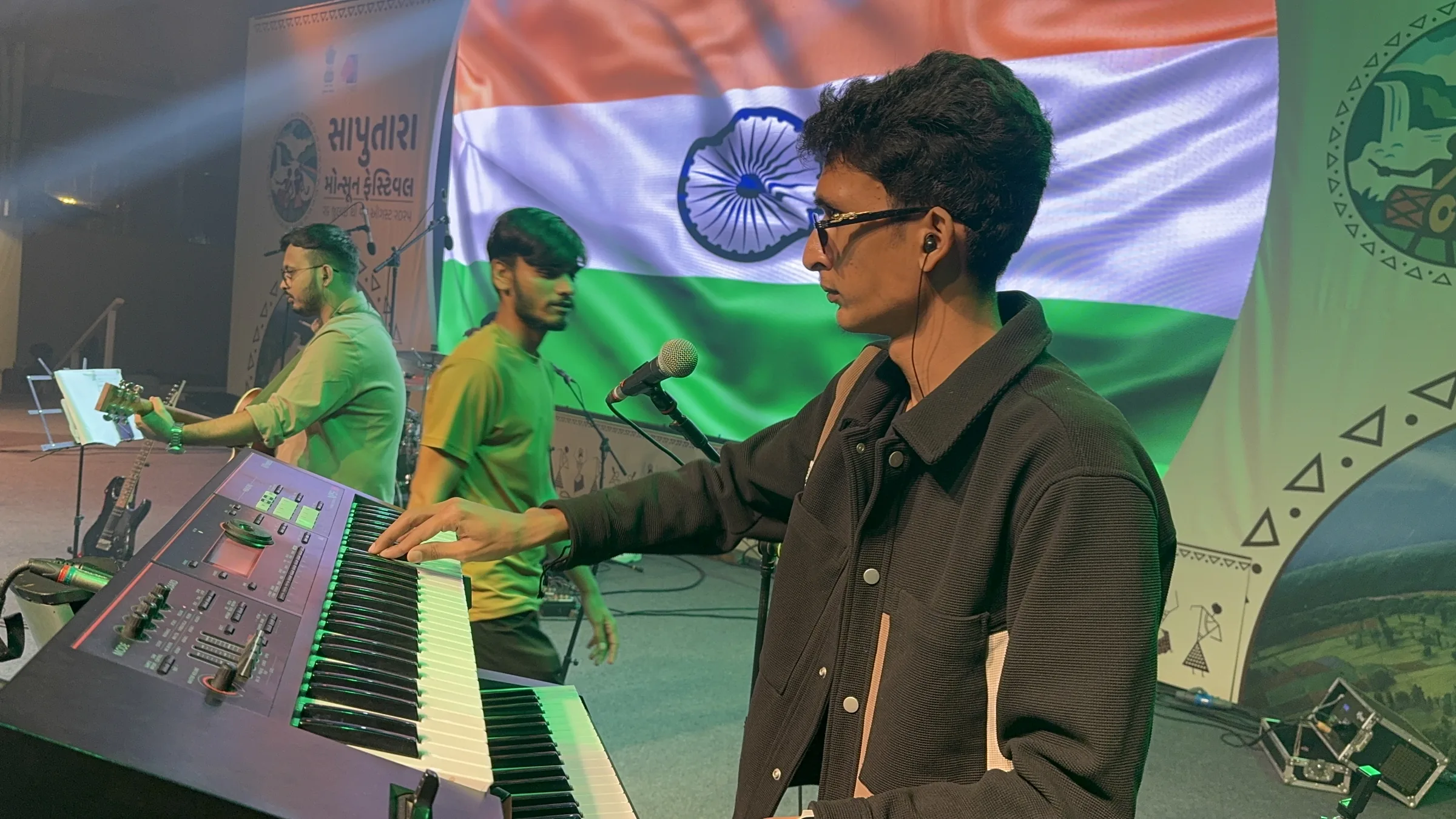 Dev Patel on keys beside the tricolour